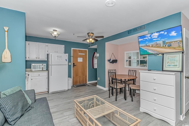 5905 S Kings Hwy Unit 1106, Myrtle Beach, SC 29575 - living room with light wood-type flooring, ceiling fan, and baseboards