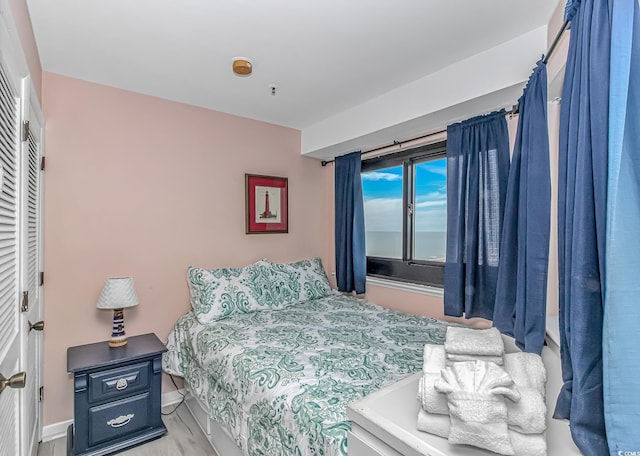 5905 S Kings Hwy Unit 1106, Myrtle Beach, SC 29575 - bedroom featuring baseboards and light wood finished floors