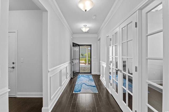 4555 Weekly Dr, Myrtle Beach, SC 29579 - foyer entrance featuring dark wood-style floors, french doors, a wainscoted wall, and ornamental molding