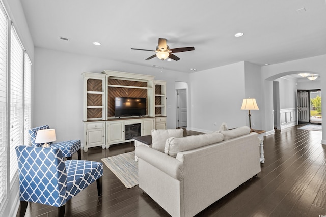 4555 Weekly Dr, Myrtle Beach, SC 29579 - living area with arched walkways, a ceiling fan, recessed lighting, dark wood-style floors, and baseboards