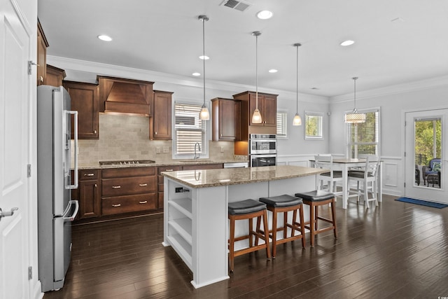 4555 Weekly Dr, Myrtle Beach, SC 29579 - kitchen featuring freestanding refrigerator, a sink, custom range hood, stainless steel double oven, and gas stovetop