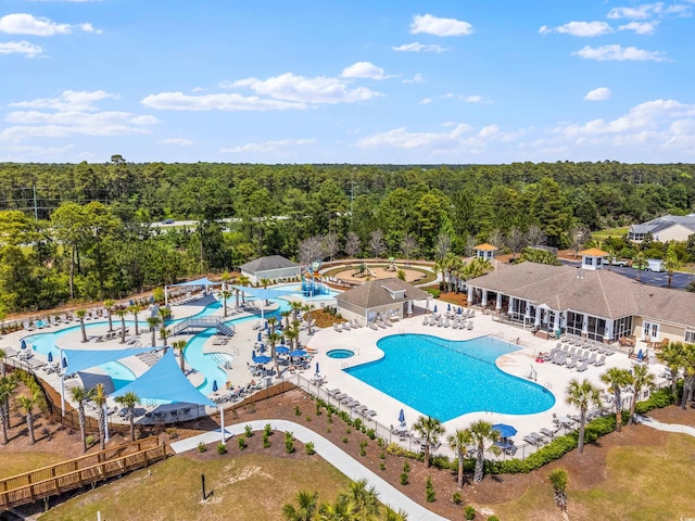 4555 Weekly Dr, Myrtle Beach, SC 29579 - community pool featuring a wooded view and a patio area