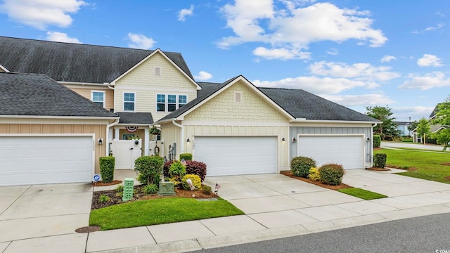 2504 Heritage Loop Unit 2504, Myrtle Beach, SC 29577 - view of front of home featuring board and batten siding, driveway, an attached garage, and a front lawn