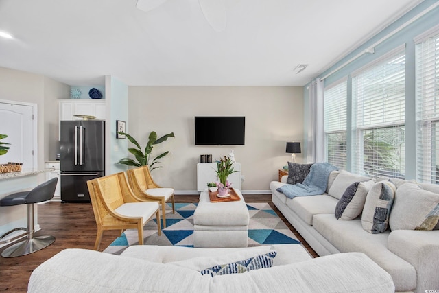 2504 Heritage Loop Unit 2504, Myrtle Beach, SC 29577 - living area featuring dark wood-style floors, ceiling fan, and baseboards