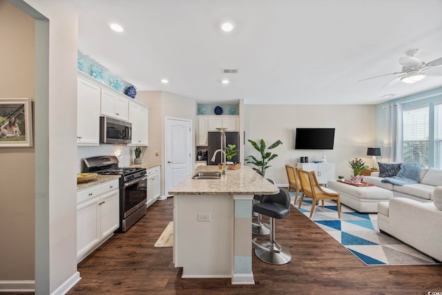 2504 Heritage Loop Unit 2504, Myrtle Beach, SC 29577 - kitchen featuring stainless steel appliances, a sink, open floor plan, dark wood-type flooring, and recessed lighting