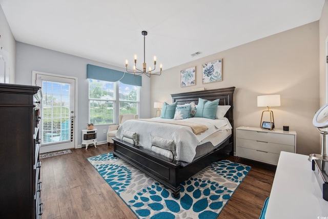 2504 Heritage Loop Unit 2504, Myrtle Beach, SC 29577 - bedroom with a chandelier, dark wood-type flooring, and access to outside