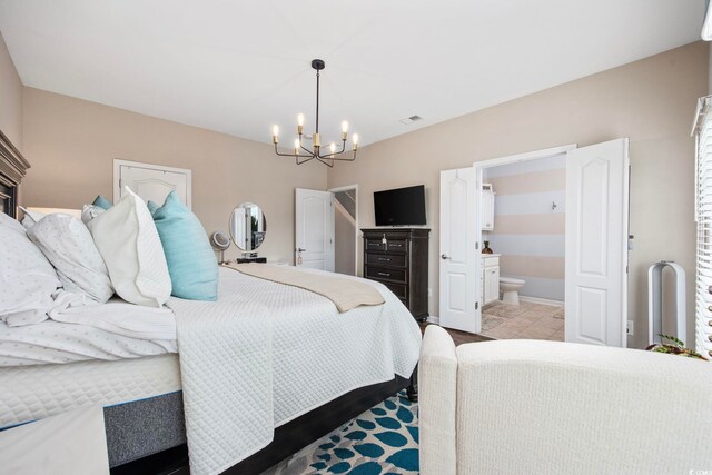 2504 Heritage Loop Unit 2504, Myrtle Beach, SC 29577 - bedroom with a chandelier and connected bathroom