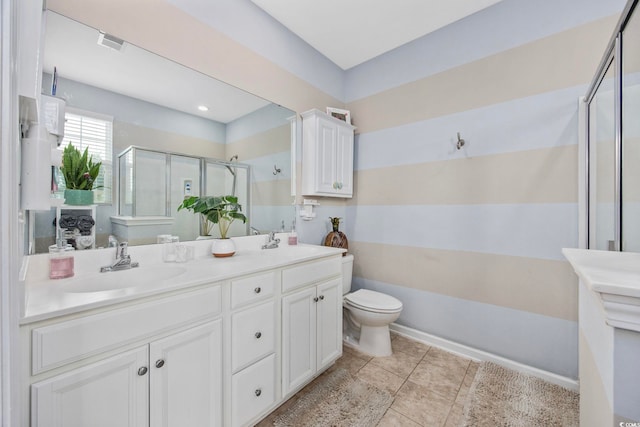 2504 Heritage Loop Unit 2504, Myrtle Beach, SC 29577 - bathroom featuring a stall shower, double vanity, toilet, and tile patterned floors