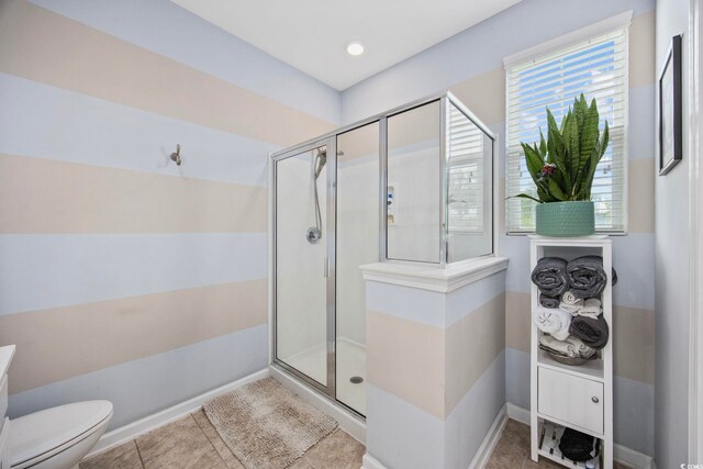 2504 Heritage Loop Unit 2504, Myrtle Beach, SC 29577 - bathroom with a shower stall, toilet, tile patterned flooring, and baseboards