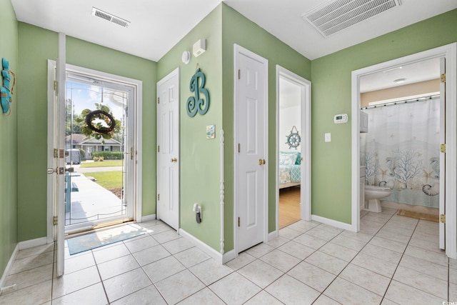 6681 Wisteria Dr, Myrtle Beach, SC 29588 - entrance foyer featuring baseboards and light tile patterned flooring