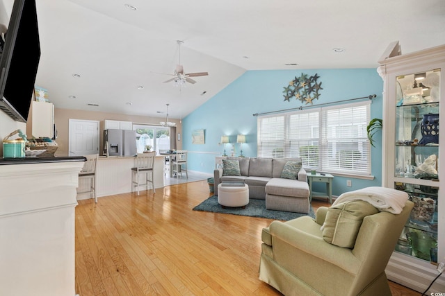 6681 Wisteria Dr, Myrtle Beach, SC 29588 - living area with a ceiling fan, lofted ceiling, light wood finished floors, and baseboards