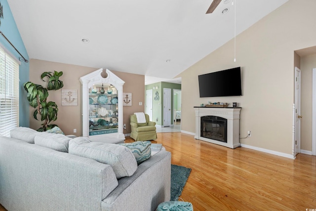 6681 Wisteria Dr, Myrtle Beach, SC 29588 - living area with light wood-style floors, ceiling fan, baseboards, a glass covered fireplace, and recessed lighting