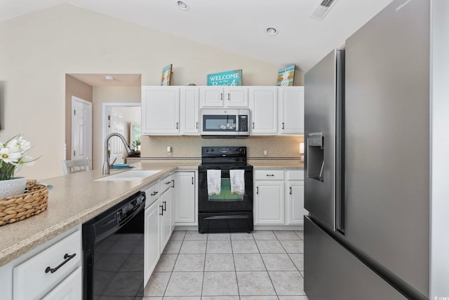 6681 Wisteria Dr, Myrtle Beach, SC 29588 - kitchen with black appliances, lofted ceiling, a sink, white cabinetry, and light countertops