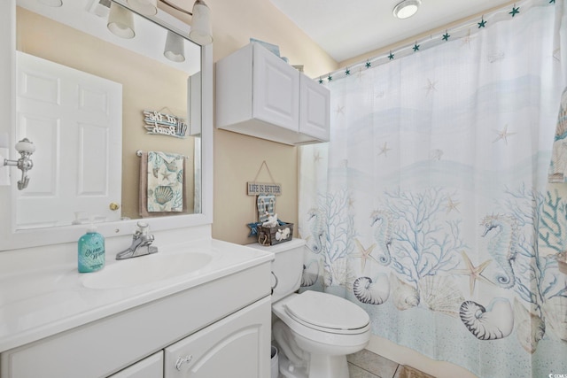 6681 Wisteria Dr, Myrtle Beach, SC 29588 - full bathroom featuring vanity, toilet, tile patterned flooring, and a shower with curtain