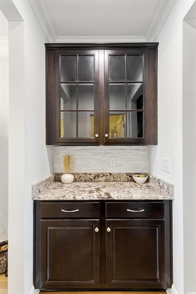 6378 Torino Ln, Myrtle Beach, SC 29572 - bar featuring tasteful backsplash, ornamental molding, and baseboards