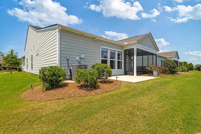6378 Torino Ln, Myrtle Beach, SC 29572 - rear view of house with a patio, a lawn, a sunroom, and central AC
