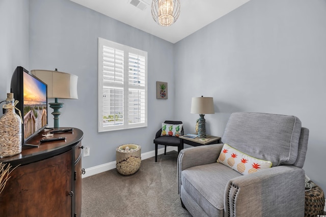 1352 Jolly Roger Dr, North Myrtle Beach, SC 29582 - living area featuring carpet flooring, baseboards, and a chandelier