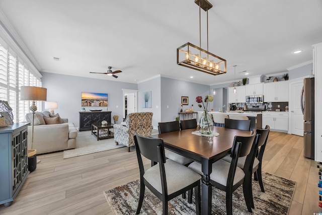 1352 Jolly Roger Dr, North Myrtle Beach, SC 29582 - dining space featuring crown molding, light wood-style flooring, ceiling fan, and recessed lighting