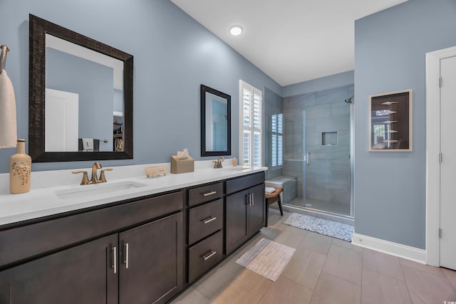 1352 Jolly Roger Dr, North Myrtle Beach, SC 29582 - bathroom with a stall shower, double vanity, baseboards, and tile patterned flooring
