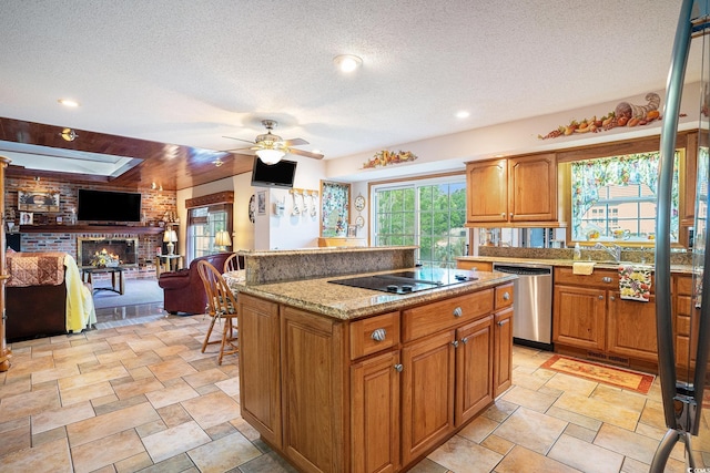 328 Waterside Dr, Myrtle Beach, SC 29577 - kitchen with stainless steel dishwasher, black electric stovetop, ceiling fan, a textured ceiling, and a center island