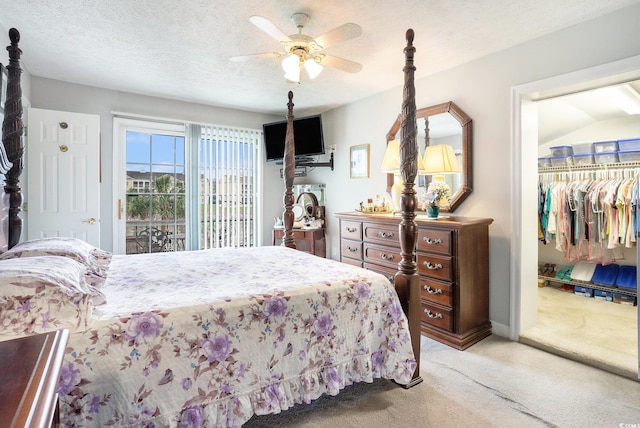 328 Waterside Dr, Myrtle Beach, SC 29577 - bedroom with light colored carpet, a spacious closet, ceiling fan, a closet, and a textured ceiling