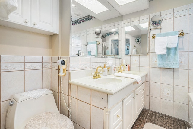 328 Waterside Dr, Myrtle Beach, SC 29577 - bathroom featuring tile walls, vanity, and toilet