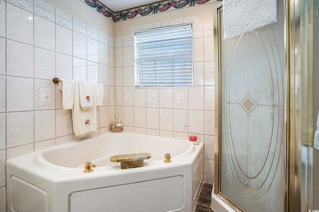 328 Waterside Dr, Myrtle Beach, SC 29577 - bathroom featuring tile walls, a bath, and a stall shower