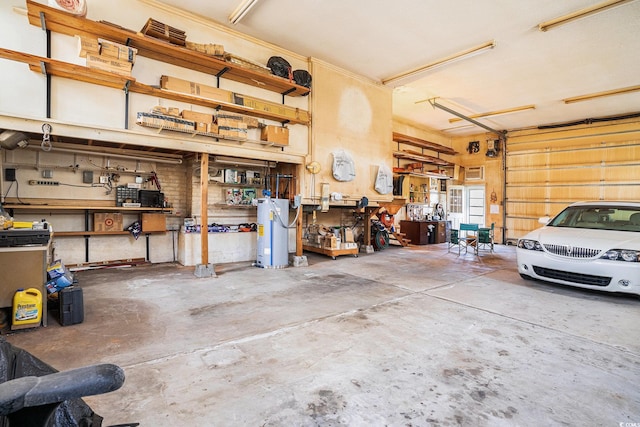 328 Waterside Dr, Myrtle Beach, SC 29577 - garage featuring water heater and a workshop area