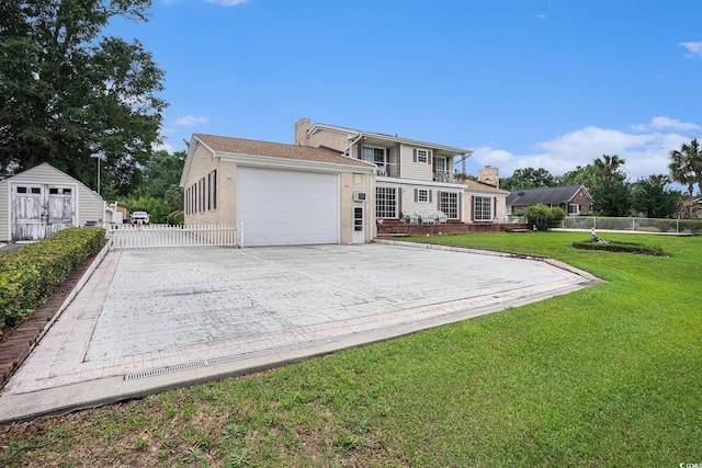 328 Waterside Dr, Myrtle Beach, SC 29577 - rear view of house featuring an attached garage and driveway