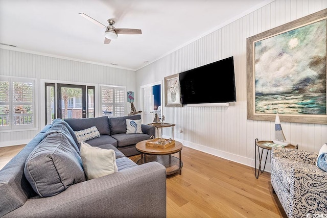 70 Beachwalker Ct, Georgetown, SC 29440 - living room featuring crown molding, ceiling fan, light wood-style flooring, and baseboards