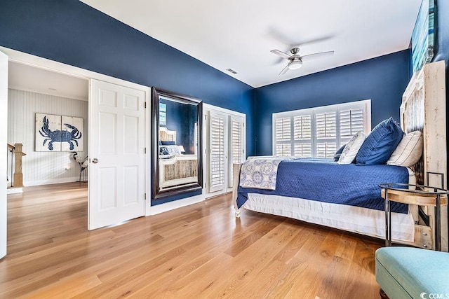 70 Beachwalker Ct, Georgetown, SC 29440 - bedroom with wood finished floors, baseboards, ceiling fan, and two closets