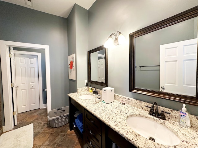 70 Beachwalker Ct, Georgetown, SC 29440 - full bathroom with double vanity and baseboards