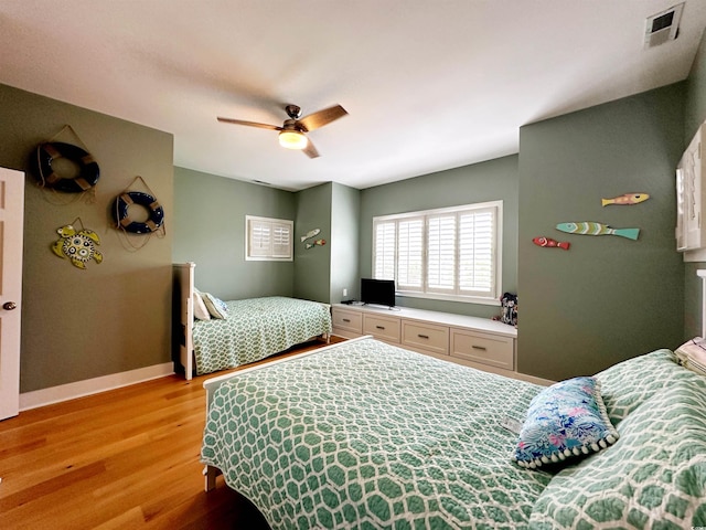 70 Beachwalker Ct, Georgetown, SC 29440 - bedroom with light wood finished floors, baseboards, and ceiling fan