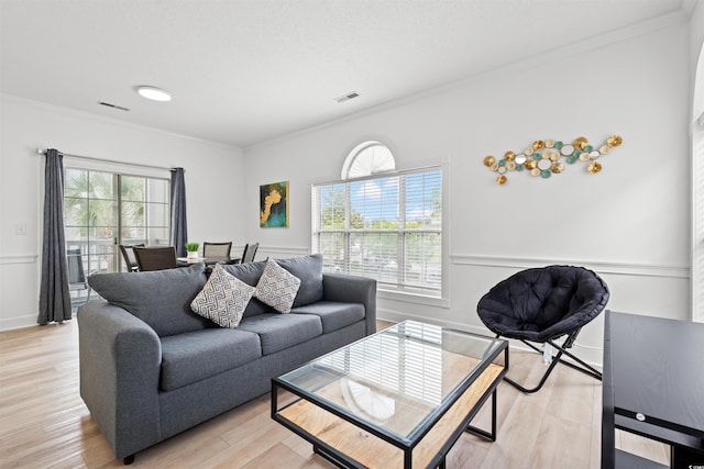 4705 Wild Iris Dr Unit 201, Myrtle Beach, SC 29577 - living room with crown molding, light wood-style floors, and baseboards