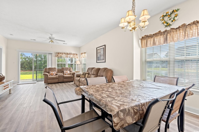 6000 Windsor Green Way Unit 104, Myrtle Beach, SC 29579 - dining area with light wood-style flooring, a chandelier, and a ceiling fan
