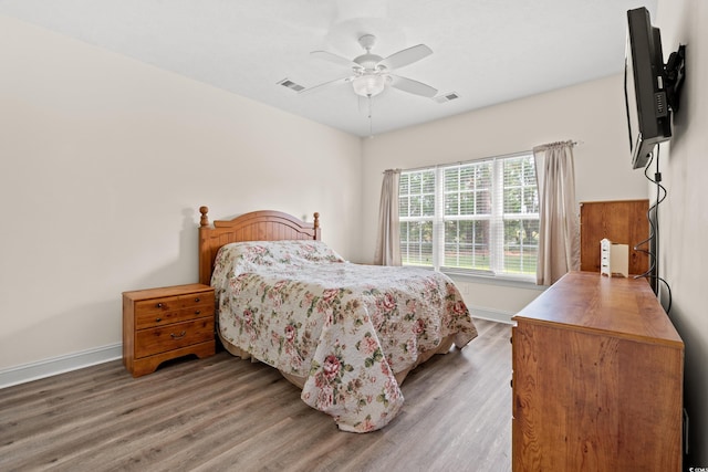 6000 Windsor Green Way Unit 104, Myrtle Beach, SC 29579 - bedroom featuring wood finished floors and ceiling fan