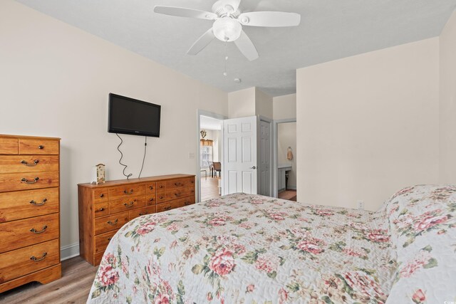 6000 Windsor Green Way Unit 104, Myrtle Beach, SC 29579 - bedroom with light wood-type flooring and a ceiling fan