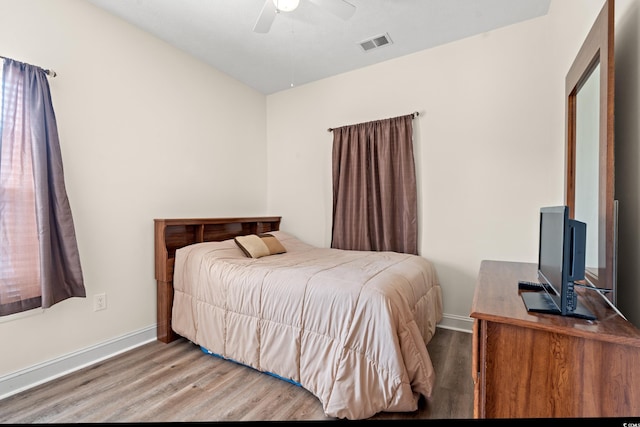 6000 Windsor Green Way Unit 104, Myrtle Beach, SC 29579 - bedroom with wood finished floors and a ceiling fan