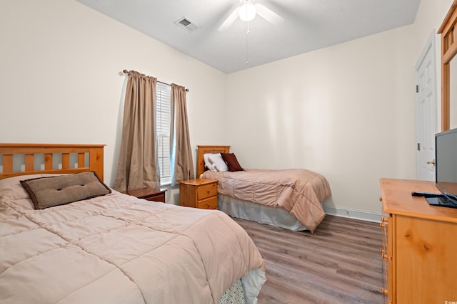 6000 Windsor Green Way Unit 104, Myrtle Beach, SC 29579 - bedroom with wood finished floors and a ceiling fan