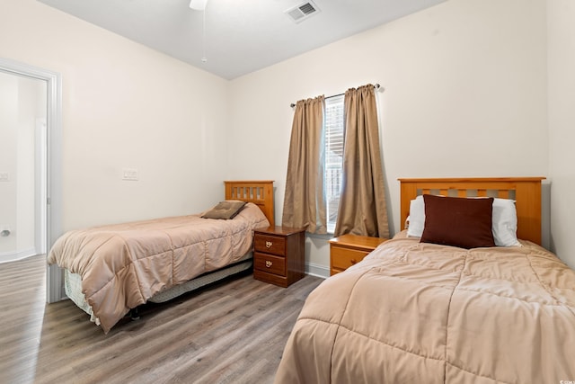 6000 Windsor Green Way Unit 104, Myrtle Beach, SC 29579 - bedroom with light wood-style floors and baseboards