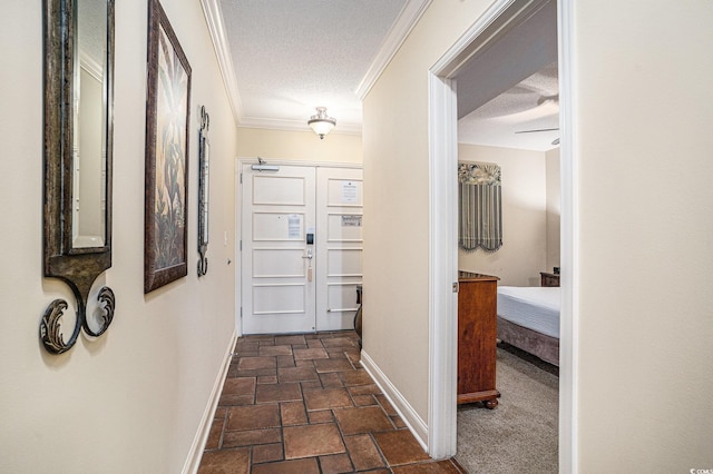 100 N Beach Blvd Unit 710, North Myrtle Beach, SC 29582 - hall with stone tile flooring, a textured ceiling, and crown molding