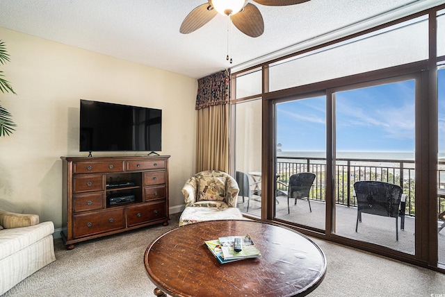 100 N Beach Blvd Unit 710, North Myrtle Beach, SC 29582 - carpeted living room featuring healthy amount of natural light and a ceiling fan