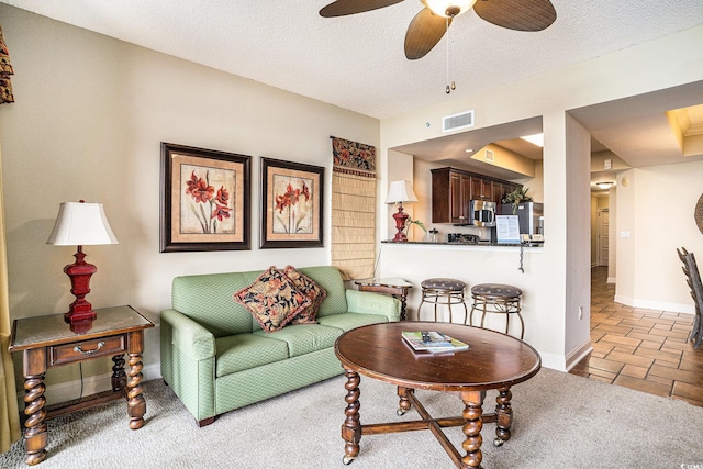 100 N Beach Blvd Unit 710, North Myrtle Beach, SC 29582 - living area featuring ceiling fan and a textured ceiling