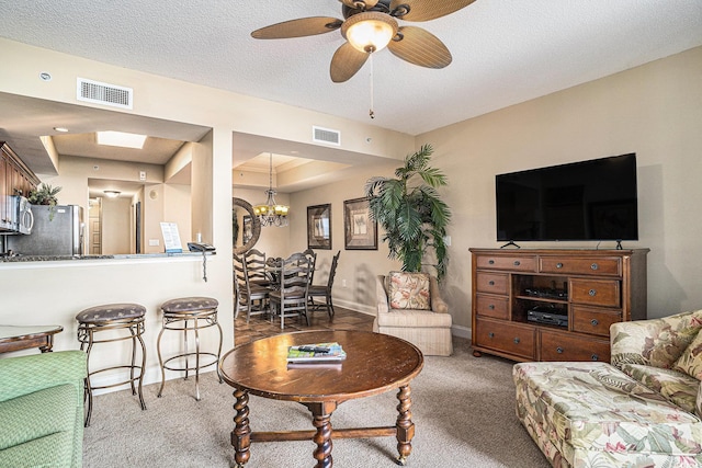 100 N Beach Blvd Unit 710, North Myrtle Beach, SC 29582 - living room with carpet flooring, a chandelier, ceiling fan, and a textured ceiling