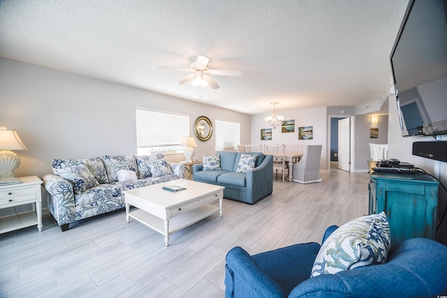 1903 S Ocean Blvd Unit 1110, North Myrtle Beach, SC 29582 - living area with a ceiling fan, a chandelier, wood tiled floors, and a textured ceiling