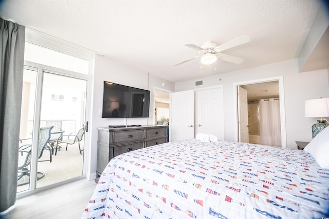 1903 S Ocean Blvd Unit 1110, North Myrtle Beach, SC 29582 - bedroom with ensuite bath, ceiling fan, and a textured ceiling