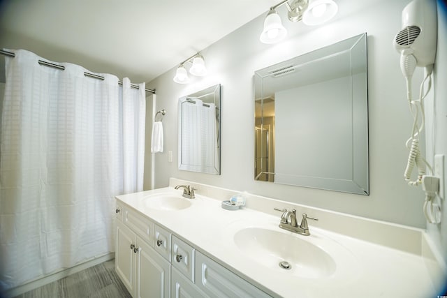 1903 S Ocean Blvd Unit 1110, North Myrtle Beach, SC 29582 - full bathroom with double vanity and a shower with shower curtain