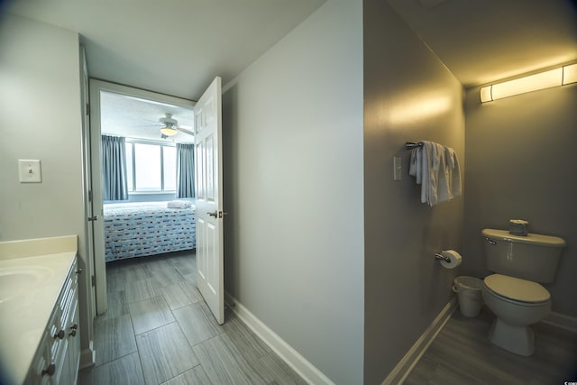 1903 S Ocean Blvd Unit 1110, North Myrtle Beach, SC 29582 - bathroom with vanity, toilet, connected bathroom, baseboards, and ceiling fan