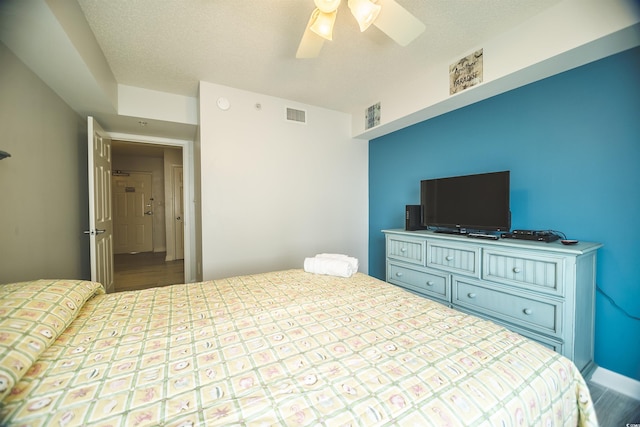 1903 S Ocean Blvd Unit 1110, North Myrtle Beach, SC 29582 - bedroom featuring a ceiling fan and wood finished floors