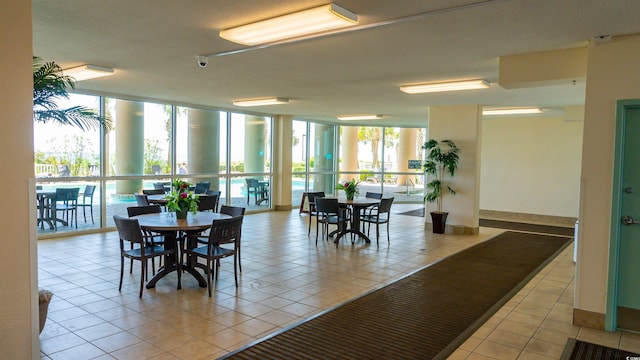1903 S Ocean Blvd Unit 1110, North Myrtle Beach, SC 29582 - dining area with expansive windows and light tile patterned floors